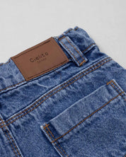 Short denim con moñitos en costados para niña