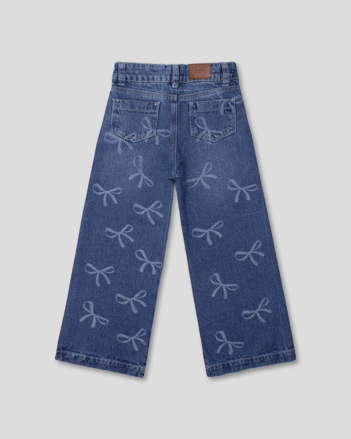 Jean denim marine fit con diseño de moños para niña