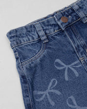 Jean denim marine fit con diseño de moños para niña