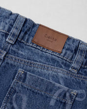 Jean denim marine fit con diseño de moños para niña