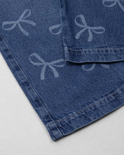 Jean denim marine fit con diseño de moños para niña
