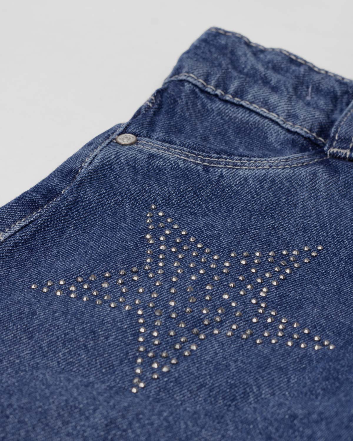 Jean denim marine fit con aplique brillante de estrellas para niña