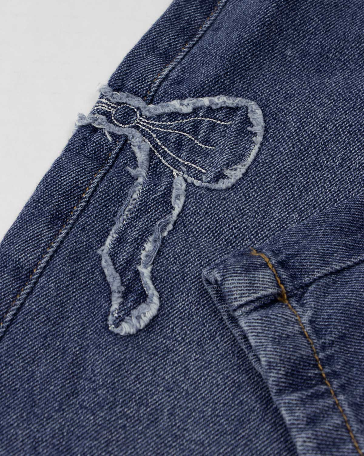 Jean denim con detalle de moños para niña