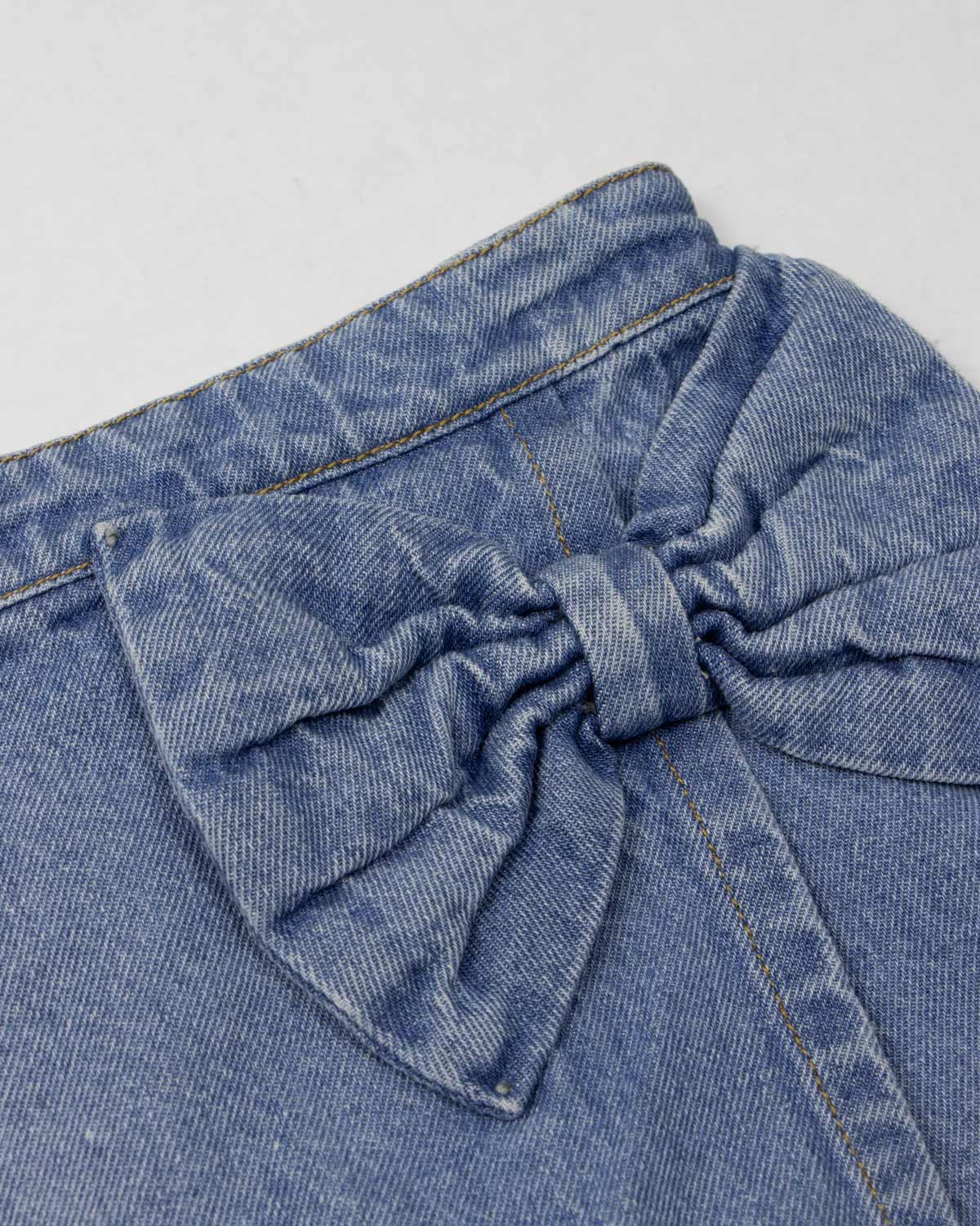 Falda short denim con moño para niña