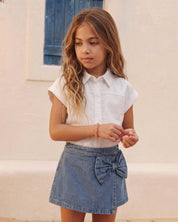 Falda short denim con moño para niña