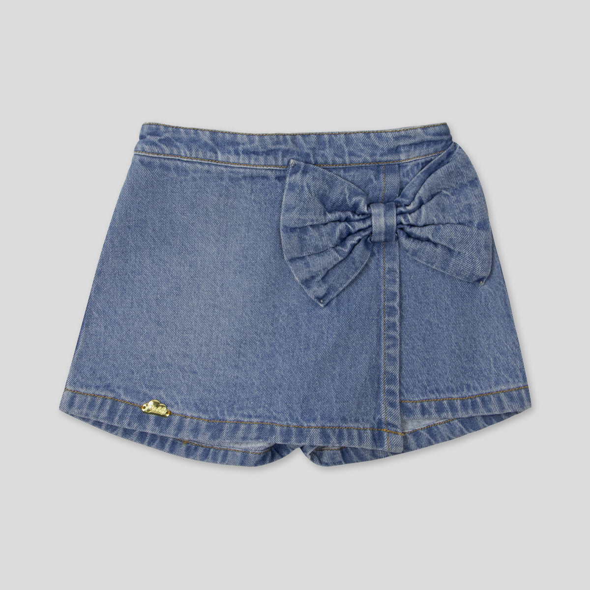 Falda short denim con moño para niña