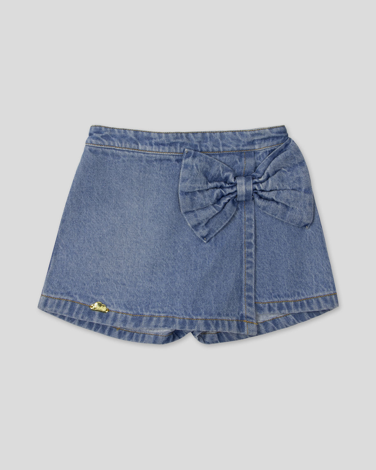 Falda short denim con moño para niña