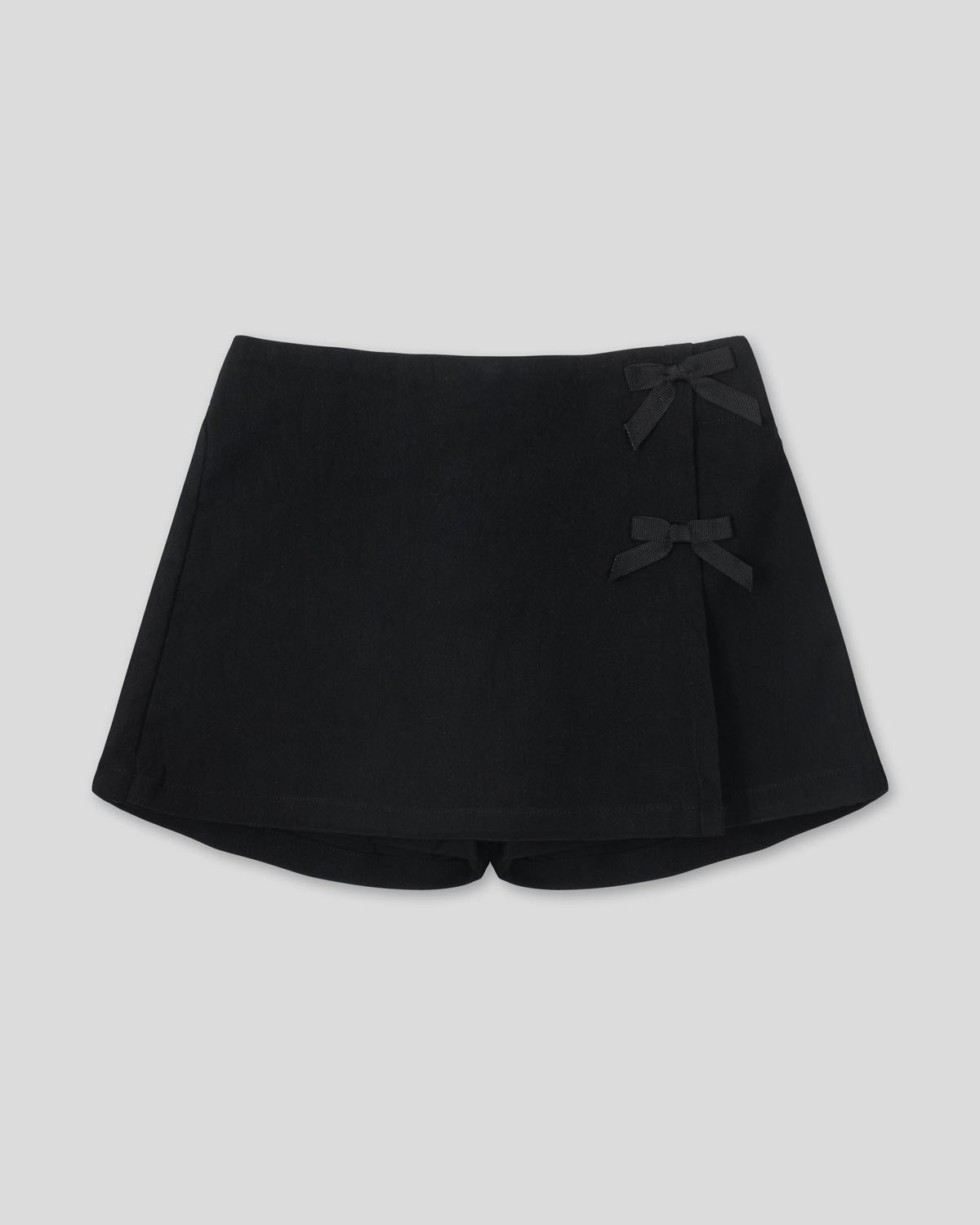 Falda short negra con moños para niña