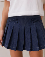Falda short denim de rayas con moñitos para niña