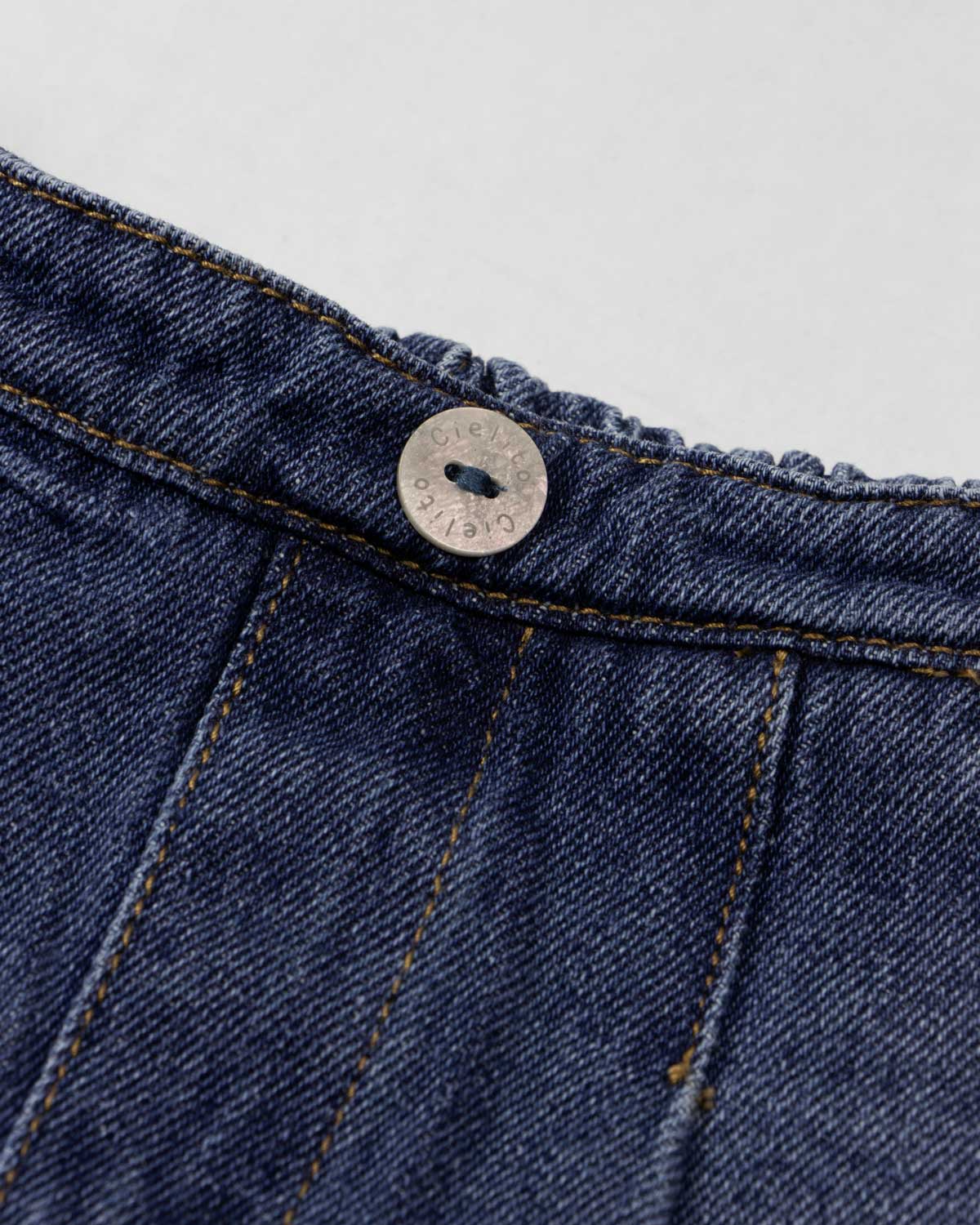 Falda short de pliegues para niña