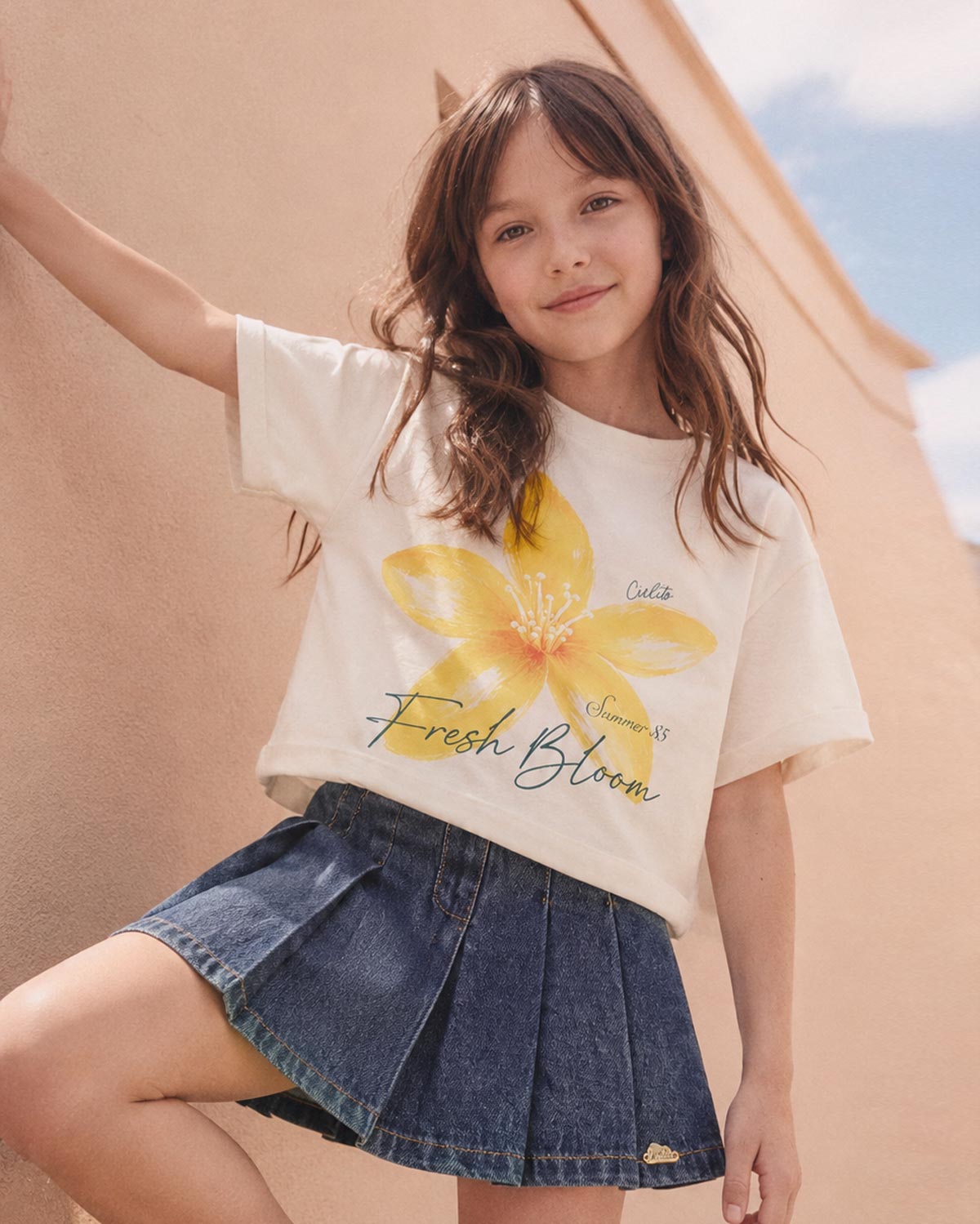 Falda short de pliegues para niña
