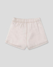 Falda short cruda con pliegues para niña