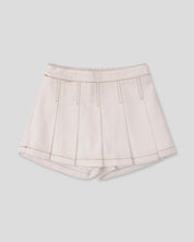 Falda short cruda con pliegues para niña