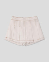 Falda short cruda con pliegues para niña