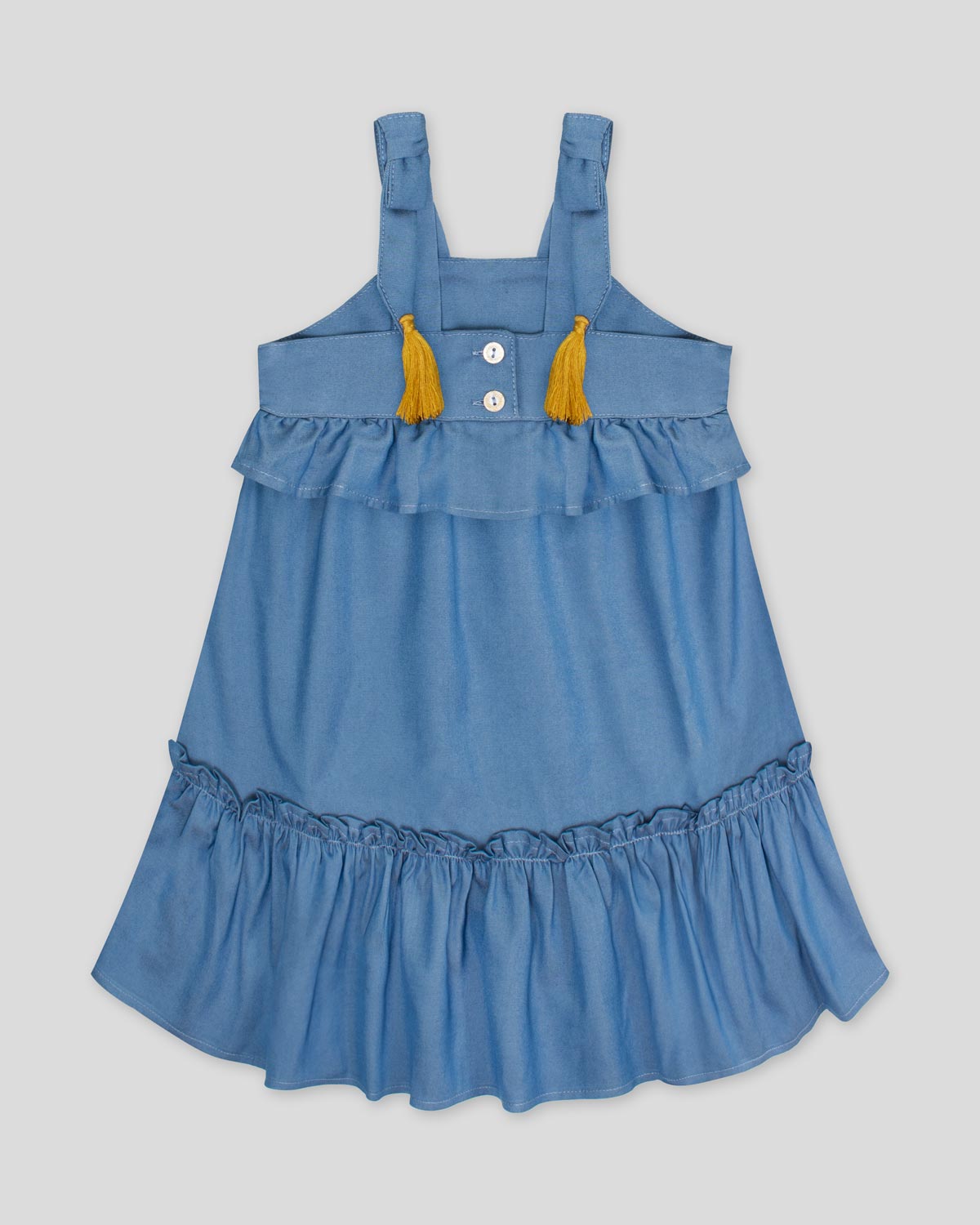 Vestido en chambray con boleros de tiras con moños y borlas para niña