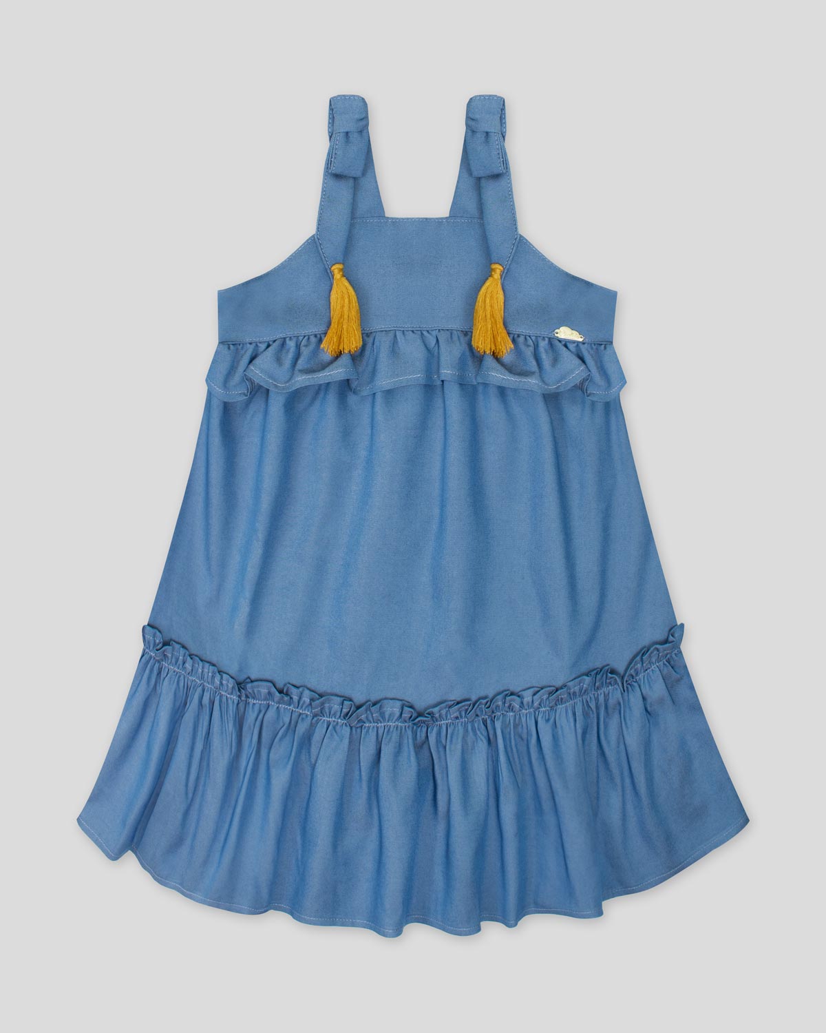 Vestido en chambray con boleros de tiras con moños y borlas para niña