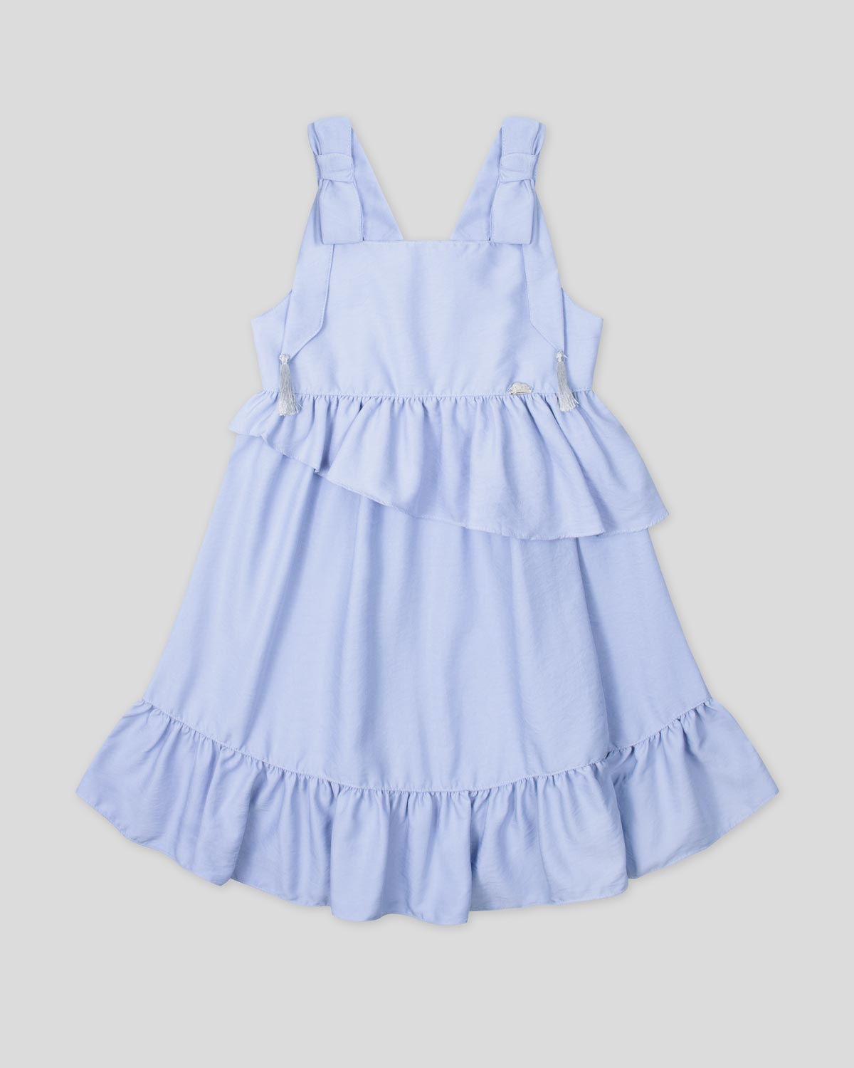 Vestido azul de tiras con detalle de moño, borlas plateadas y boleros para niña