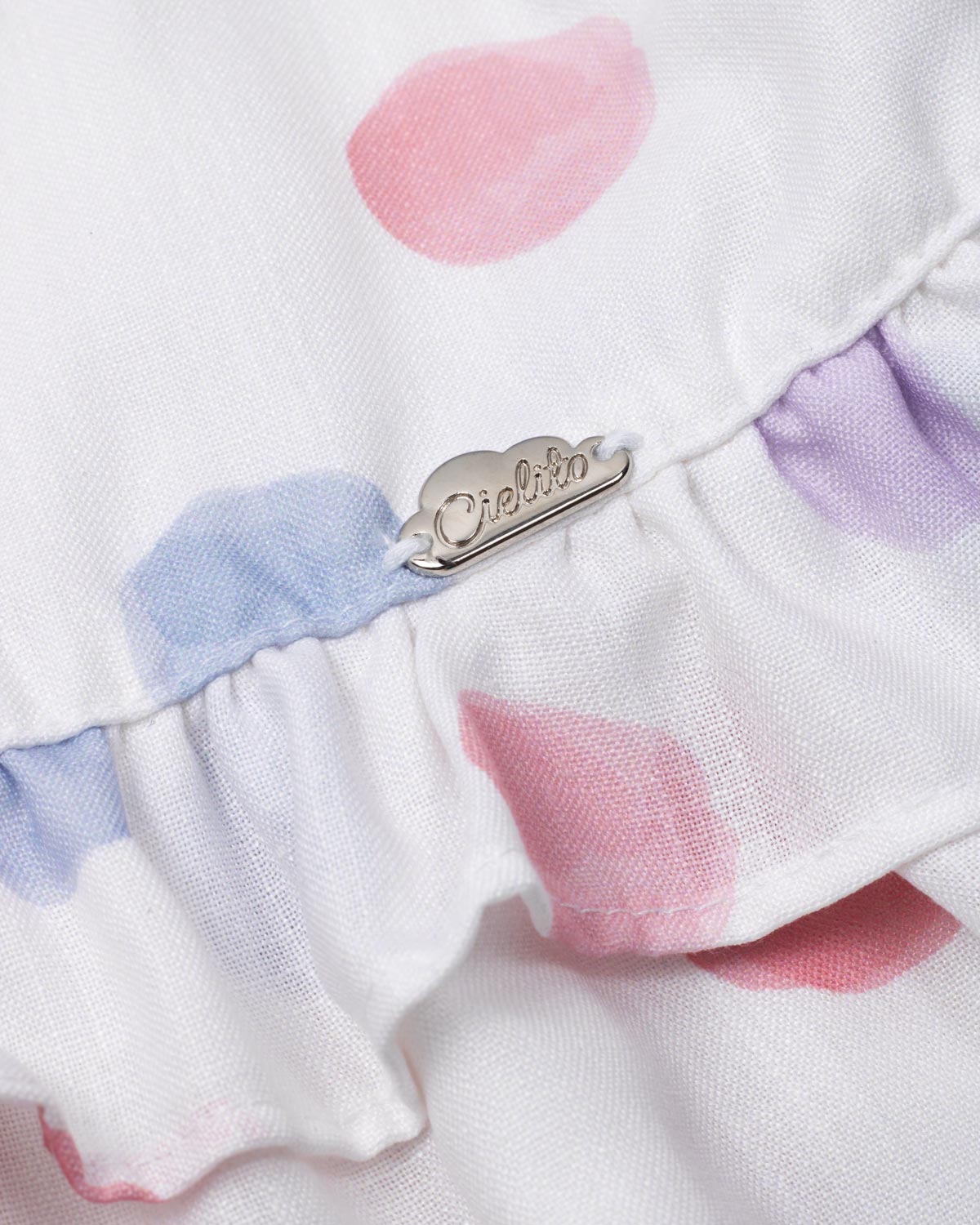 Vestido en lino estampado con lunares y tiras con moños lila para niña