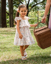 Vestido en lino estampado de flores con boleros y botones en espalda para niña