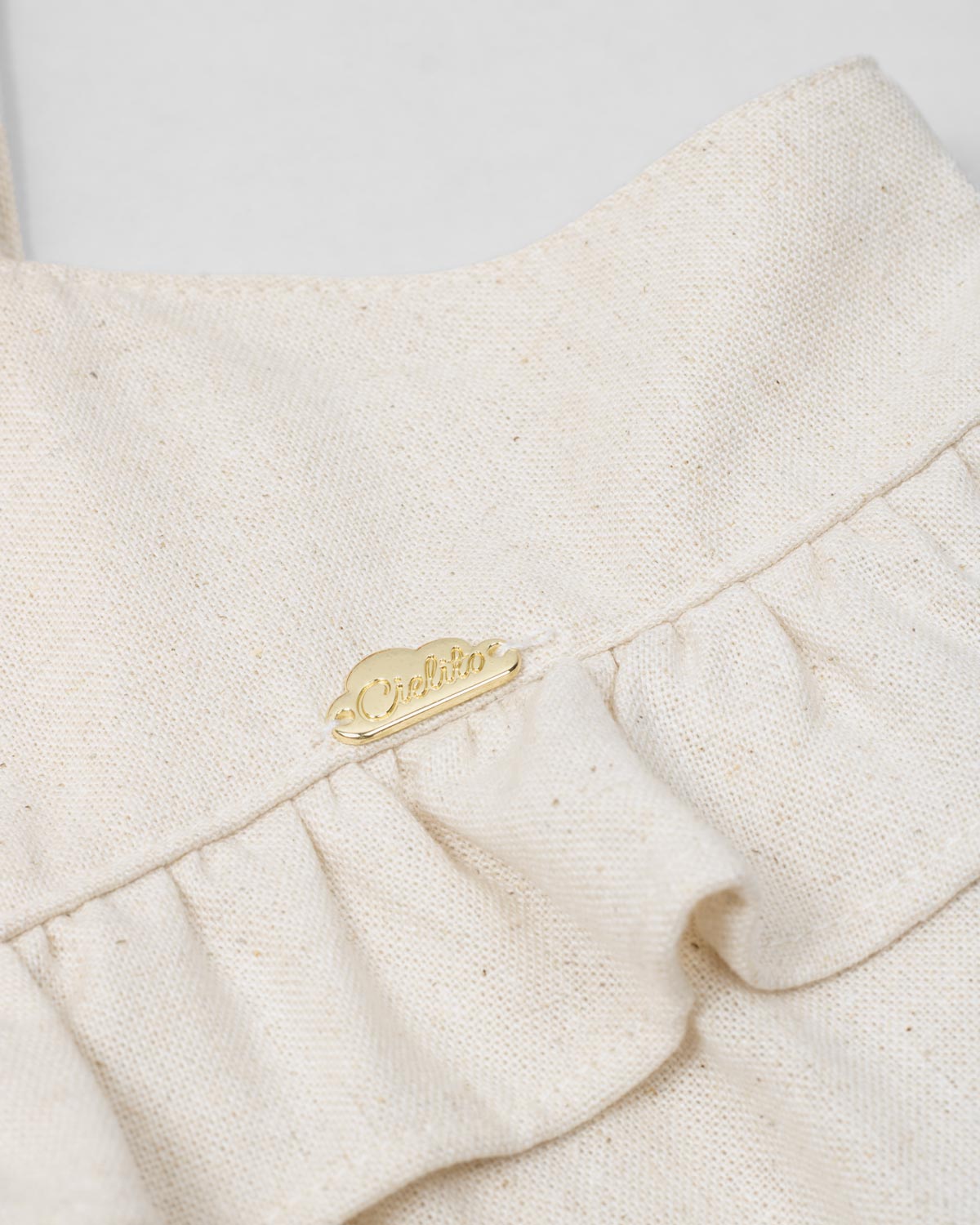 Vestido en lino de tiras con moños y boleros para niña
