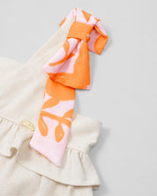Vestido en lino de tiras con moños y boleros para niña