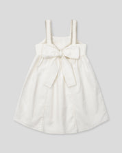 Vestido en lino con textura tejida y moño en espalda para niña