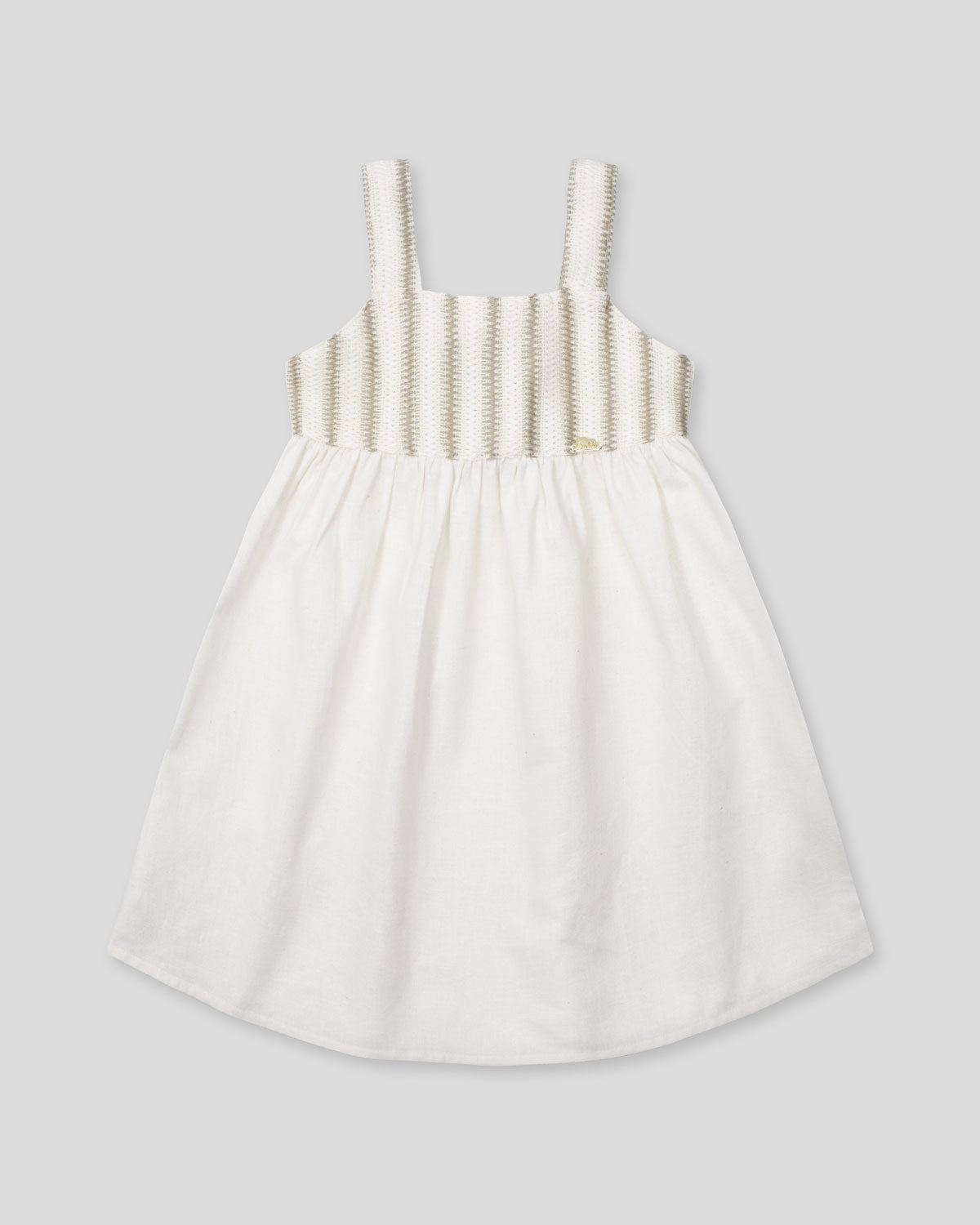 Vestido en lino con textura tejida y moño en espalda para niña