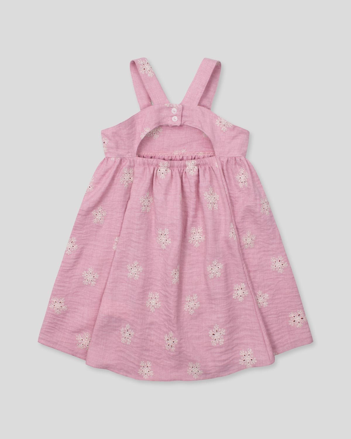 Vestido de tiras en lino rosado con flores y botonadura en espalda para niña