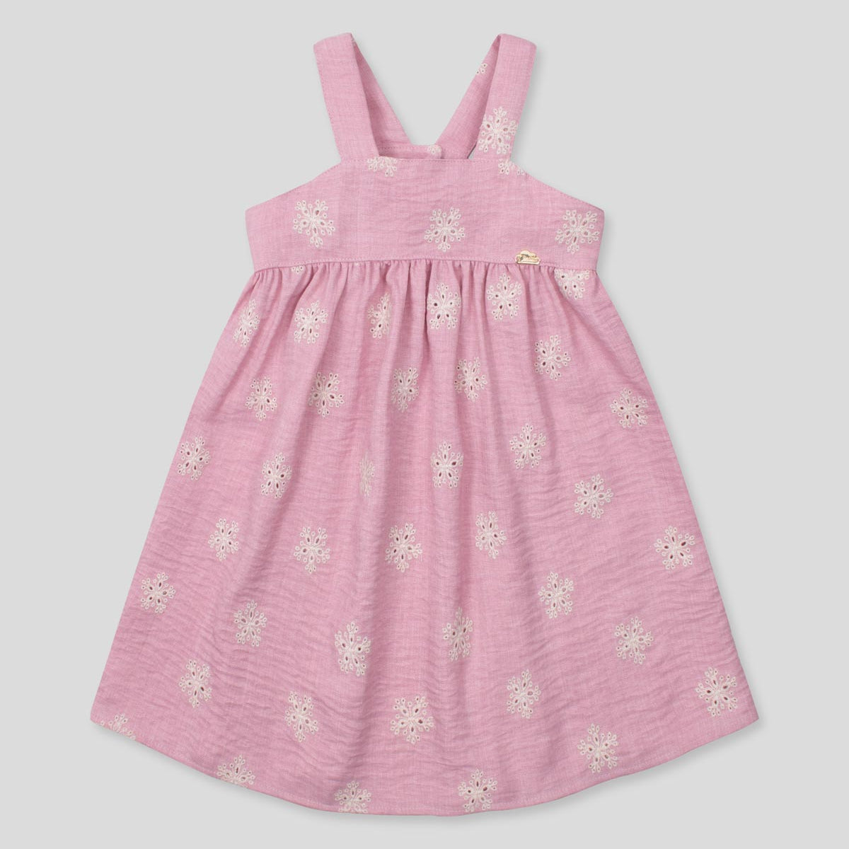 Vestido de tiras en lino rosado con flores y botonadura en espalda para niña