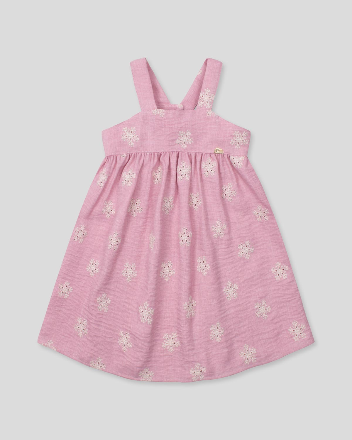 Vestido de tiras en lino rosado con flores y botonadura en espalda para niña