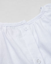 Vestido en lino blanco con estampado de flores para niña