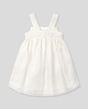 Vestido blanco con moño y líneas plateadas para niña