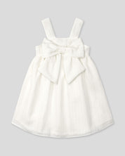 Vestido blanco con moño y líneas plateadas para niña