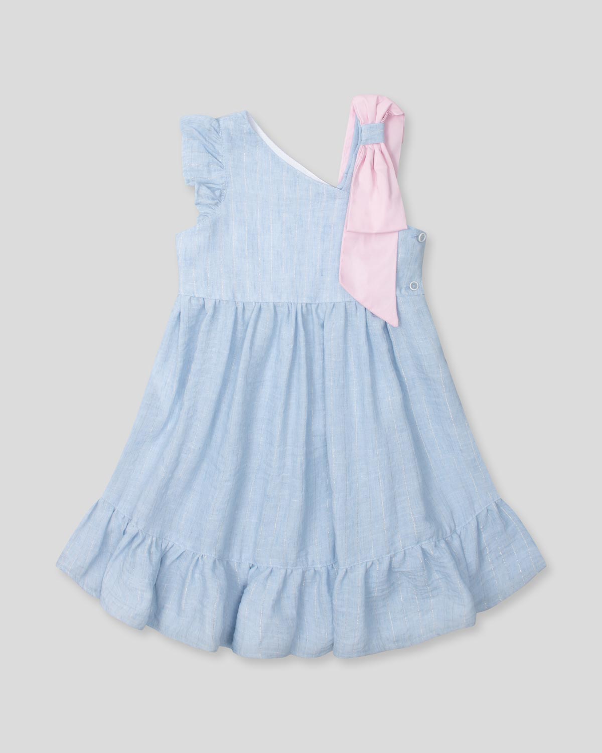 Vestido azul con moño rosado en hombro y brillos para niña