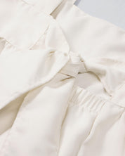 Vestido de tiras con textura tejida y lazos en espalda para niña