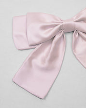 Moño pinza rosa satinado para niña