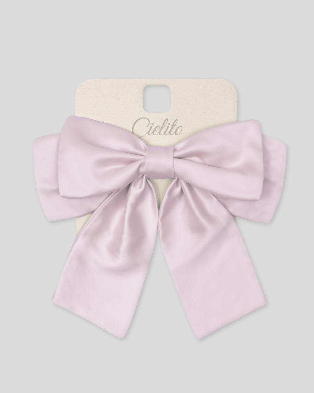 Moño pinza rosa satinado para niña