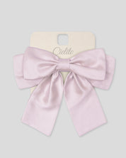Moño pinza rosa satinado para niña