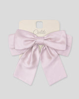 Moño pinza rosa satinado para niña