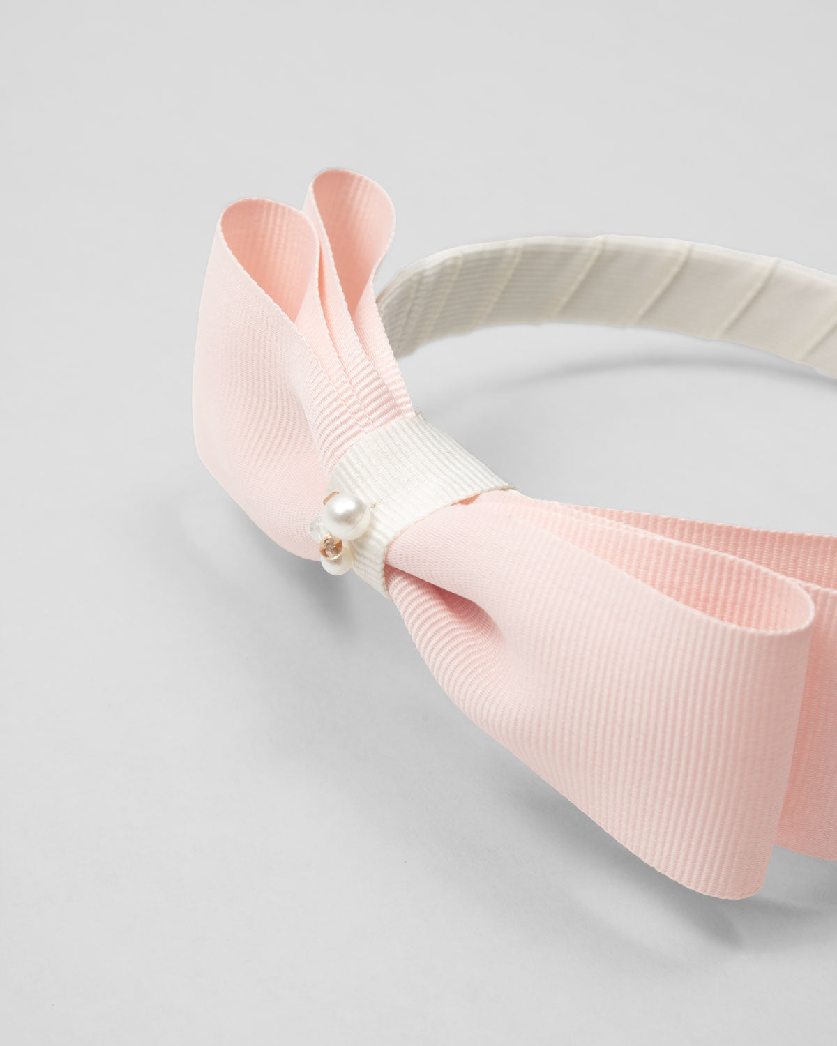 Diadema con moño rosa para niña