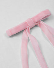 Moño pinza de cintas rosa