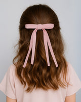 Moño pinza de cintas rosa