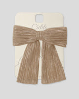 Moño dorado plisado con brillos para niña