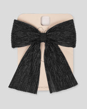 Moño pinza negro plisado con brillos para niña