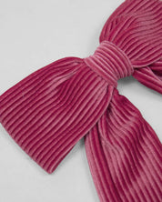 Moño pinza fucsia en tejido rib para niña