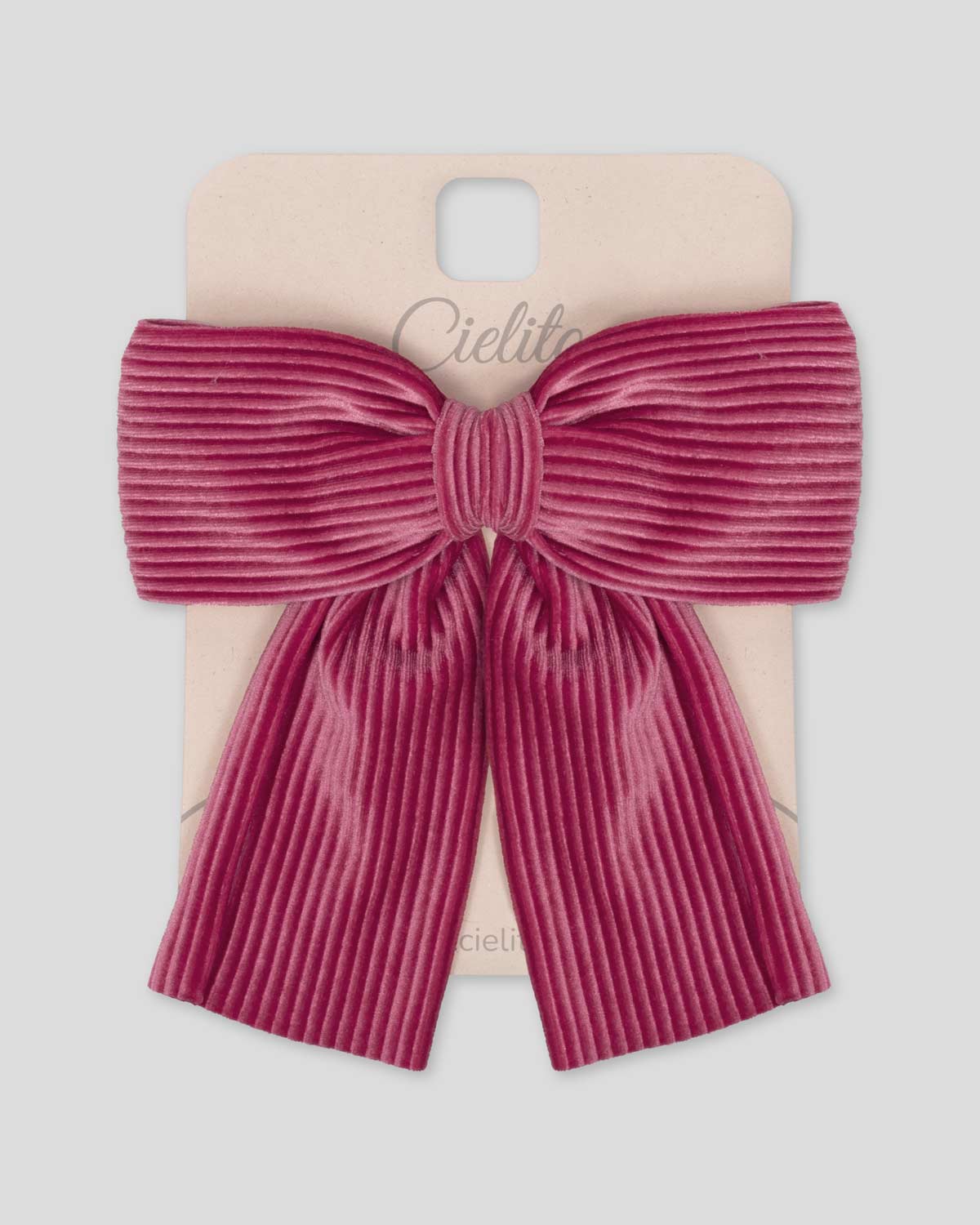 Moño pinza fucsia en tejido rib para niña