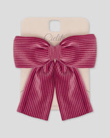 Moño pinza fucsia en tejido rib para niña