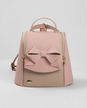 Bolso tipo mochila rosa con detalle de moño y cierre para niña