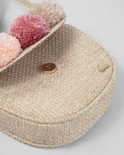 Bolso tejido con pompones y botón de imán para niña