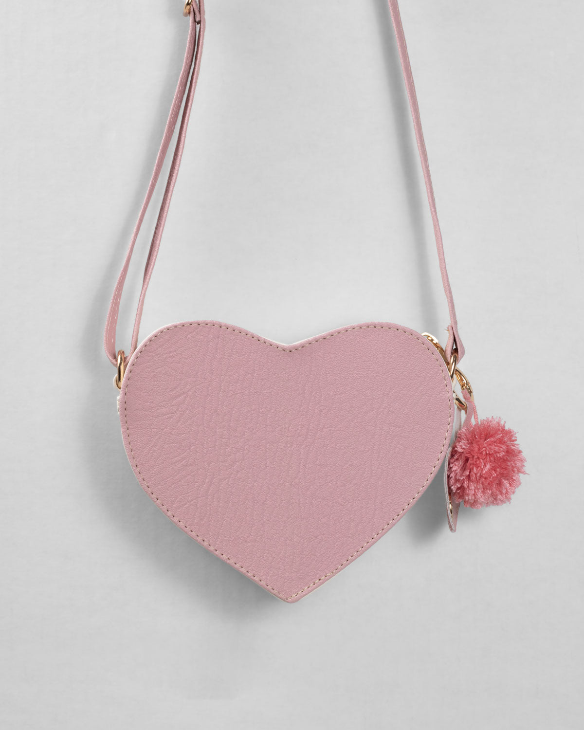 Bolso corazón con pompón para niña